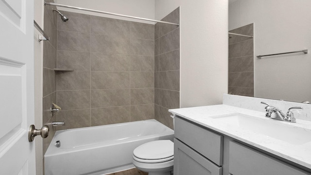 full bathroom with vanity, toilet, and tiled shower / bath combo