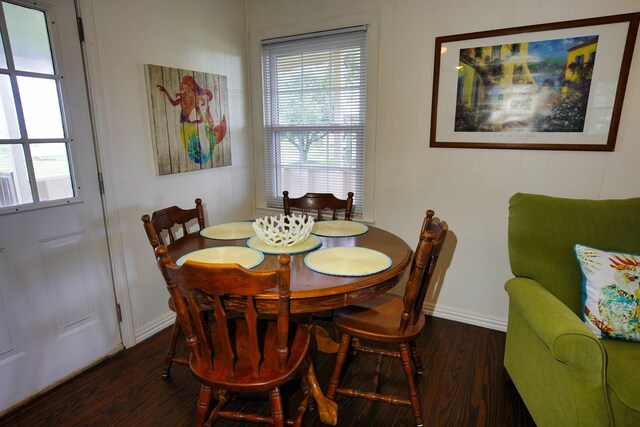 dining room with dark wood-type flooring