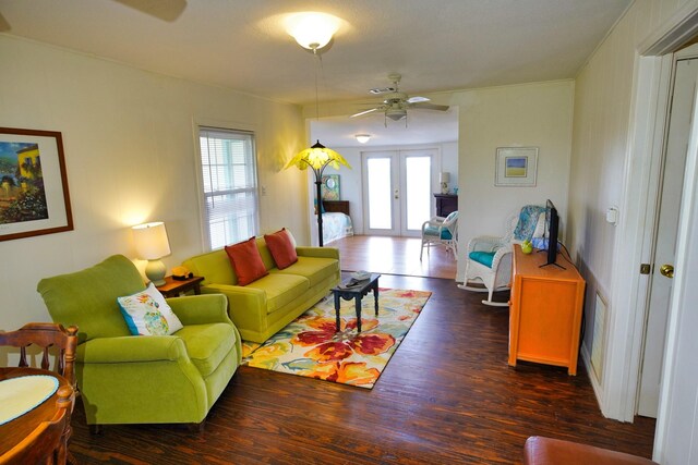 living room featuring dark hardwood / wood-style floors, ceiling fan, and french doors