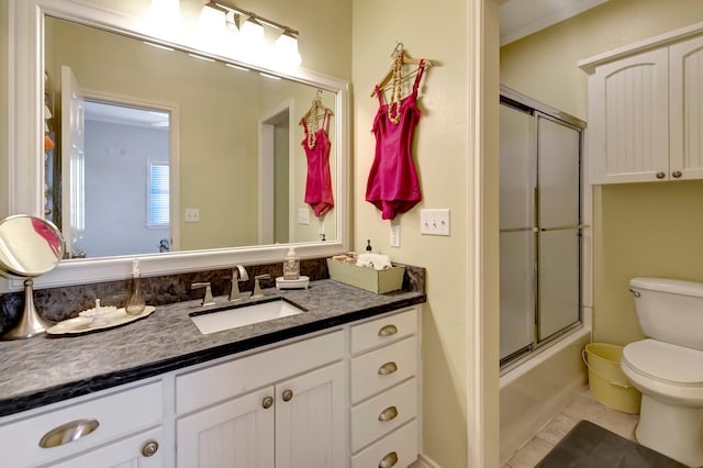 4850 County Road 328, Vanderbilt, TX 77969 - bathroom with bath / shower combo with glass door, toilet, and vanity