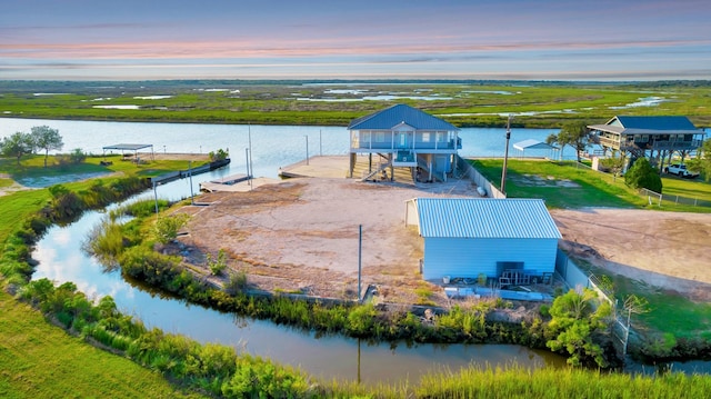 4850 County Road 328, Vanderbilt, TX 77969 - aerial view at dusk featuring a water view