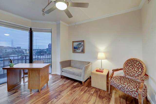 office with wood-type flooring, ceiling fan, and crown molding