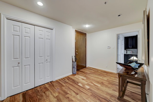 corridor with light wood-type flooring