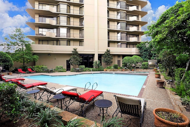 view of swimming pool with a patio