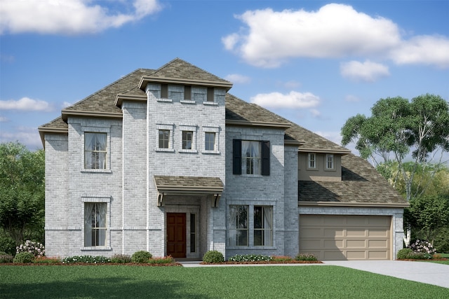 view of front of home with a front yard and a garage