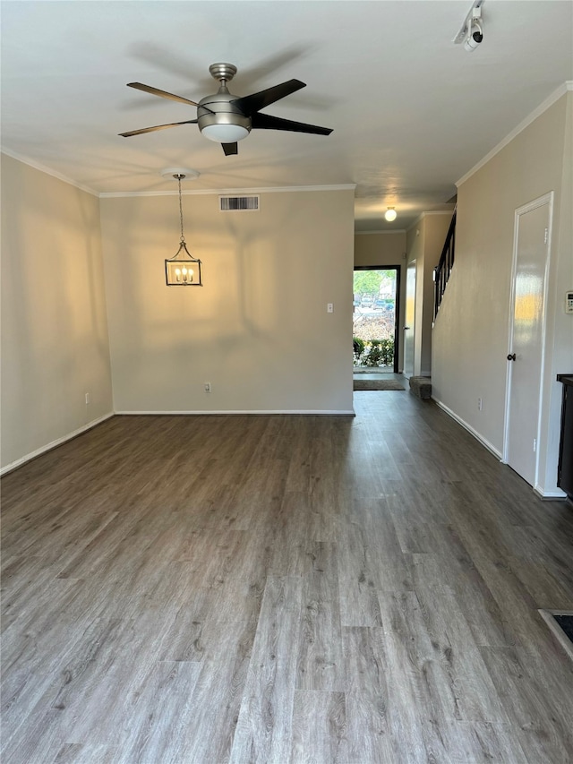 spare room with ceiling fan, hardwood / wood-style flooring, and crown molding