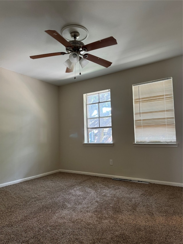 carpeted empty room featuring ceiling fan