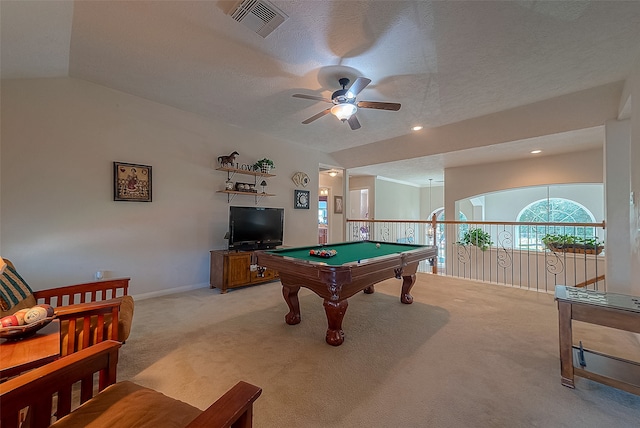 rec room with vaulted ceiling, a textured ceiling, ceiling fan, pool table, and light colored carpet