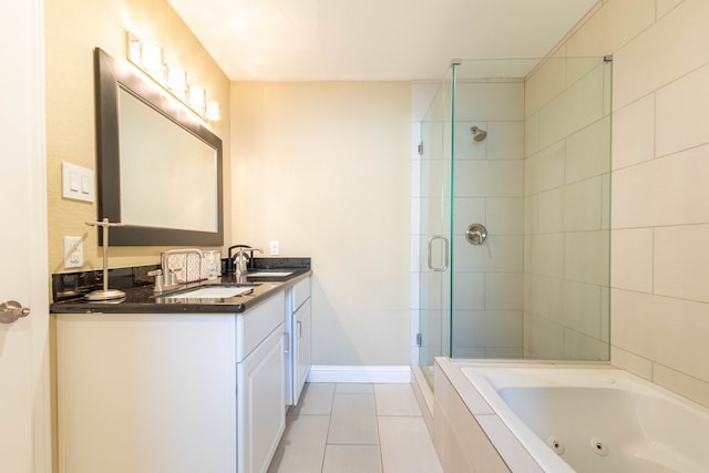 bathroom featuring vanity, tile patterned flooring, and shower with separate bathtub