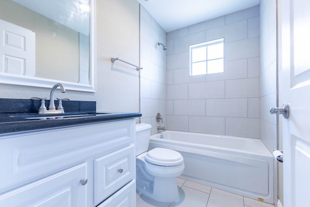 full bathroom with toilet, vanity, tiled shower / bath combo, and tile patterned flooring