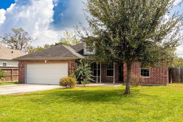 view of front of home featuring a garage and a front yard