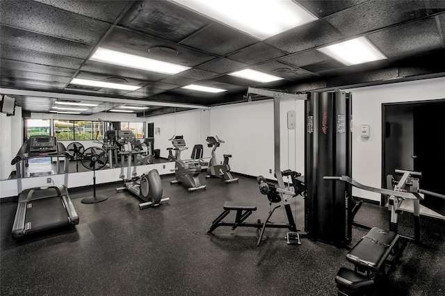 gym featuring a drop ceiling