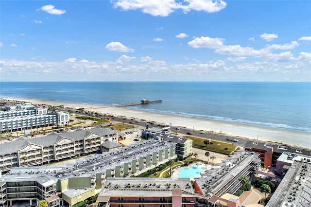 birds eye view of property featuring a beach view and a water view