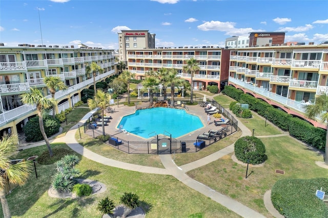 view of swimming pool featuring a lawn