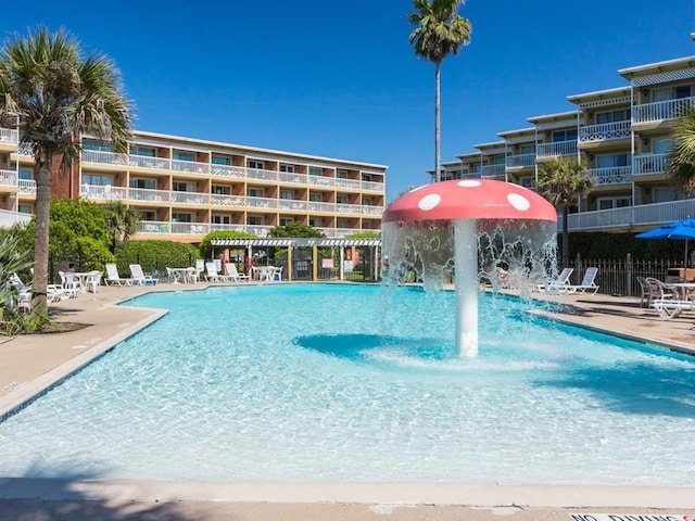 view of pool with pool water feature