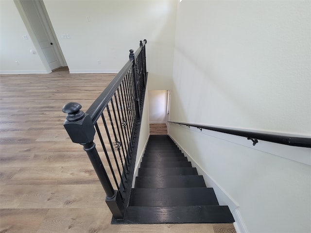 stairway featuring hardwood / wood-style floors