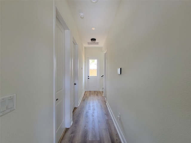 corridor featuring light wood-type flooring