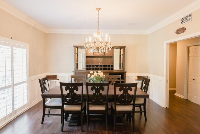 dining room featuring crown molding, dark hardwood / wood-style floors, and a wealth of natural light