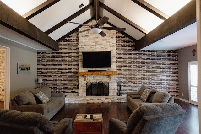 living room with dark wood-type flooring, ceiling fan, brick wall, and a fireplace