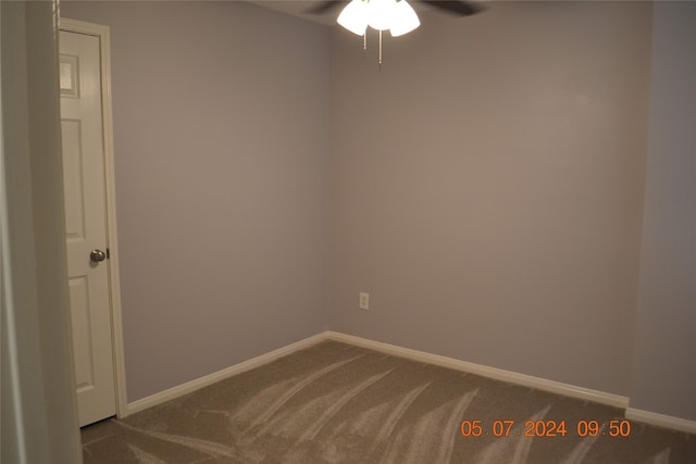 empty room with carpet and ceiling fan