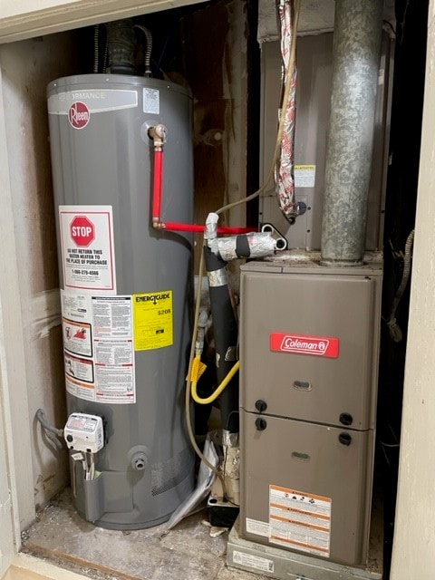 utility room with water heater