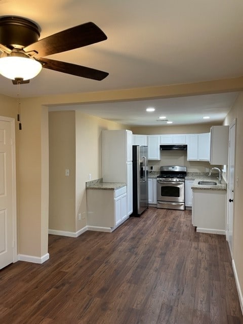 kitchen with ceiling fan, sink, dark hardwood / wood-style flooring, white cabinets, and appliances with stainless steel finishes