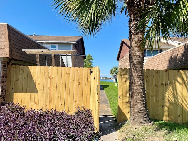 view of property exterior featuring a water view