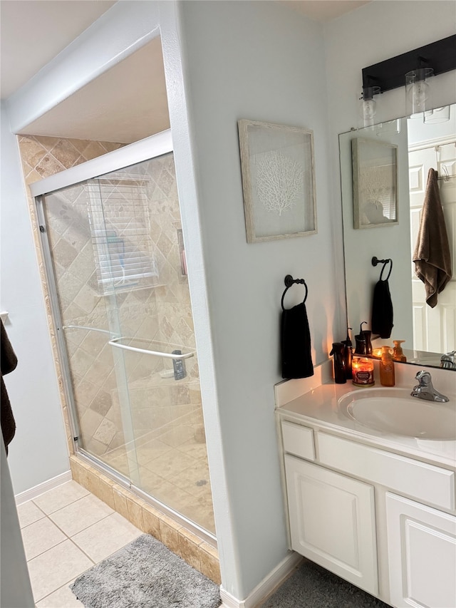 bathroom featuring walk in shower, tile patterned floors, and vanity