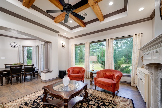 living room featuring hardwood / wood-style flooring, beamed ceiling, and a wealth of natural light