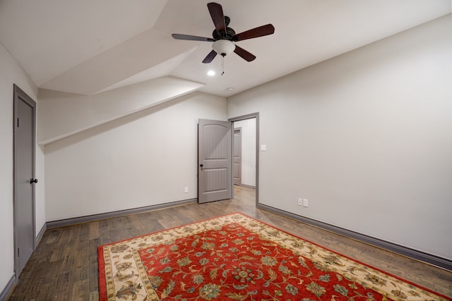 unfurnished bedroom featuring ceiling fan, vaulted ceiling, and wood-type flooring