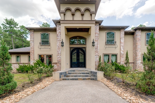 doorway to property featuring french doors