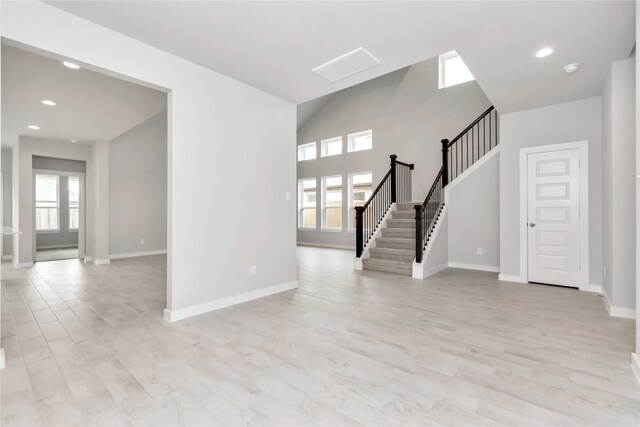 unfurnished living room featuring light wood-type flooring