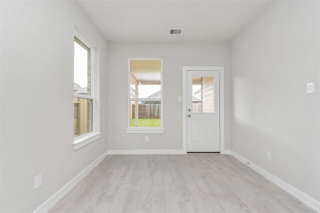 unfurnished room with light hardwood / wood-style flooring