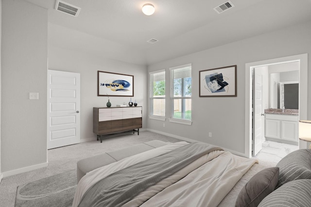 bedroom featuring visible vents, baseboards, and light colored carpet