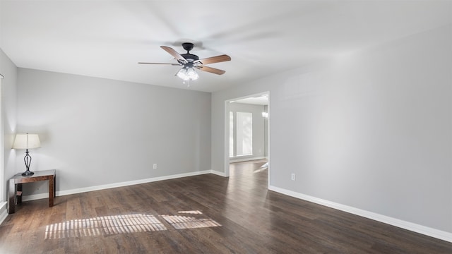 unfurnished room featuring ceiling fan and dark hardwood / wood-style floors