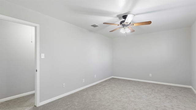 empty room with carpet floors and ceiling fan