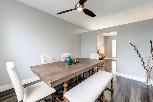 dining room featuring ceiling fan and dark hardwood / wood-style flooring