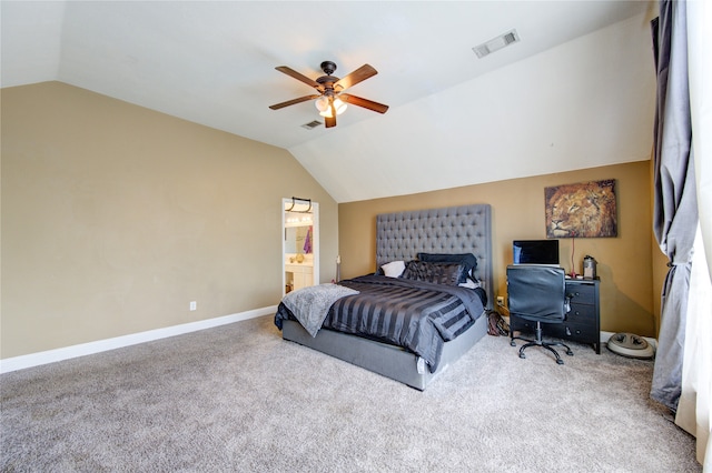 bedroom featuring ceiling fan, carpet, vaulted ceiling, and ensuite bathroom