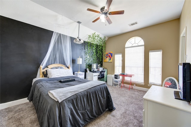 bedroom featuring ceiling fan, light carpet, and vaulted ceiling