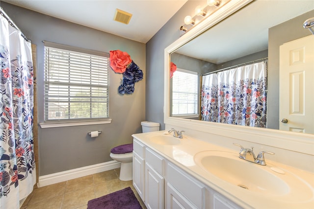 bathroom with vanity, toilet, a shower with curtain, and tile patterned flooring