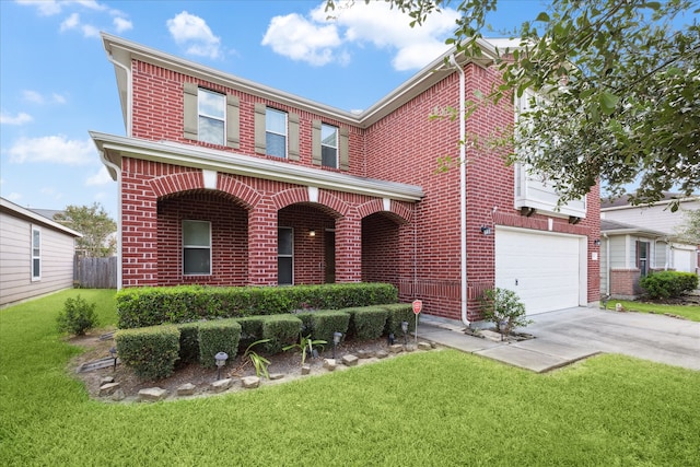 view of front of home featuring a front yard and a garage