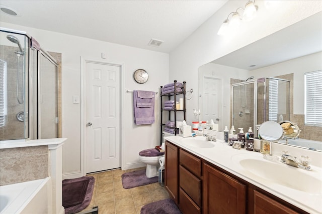 full bathroom with a stall shower, visible vents, a sink, and a bath