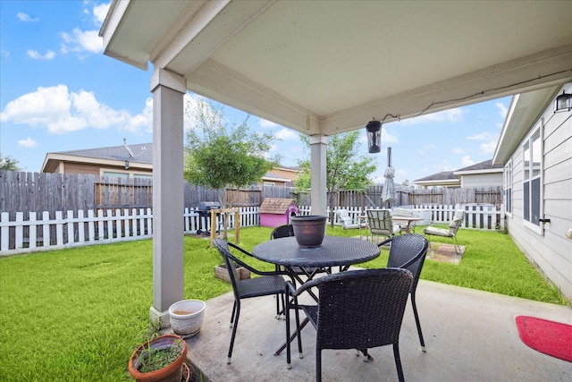 view of patio featuring fence private yard, outdoor dining area, and a grill