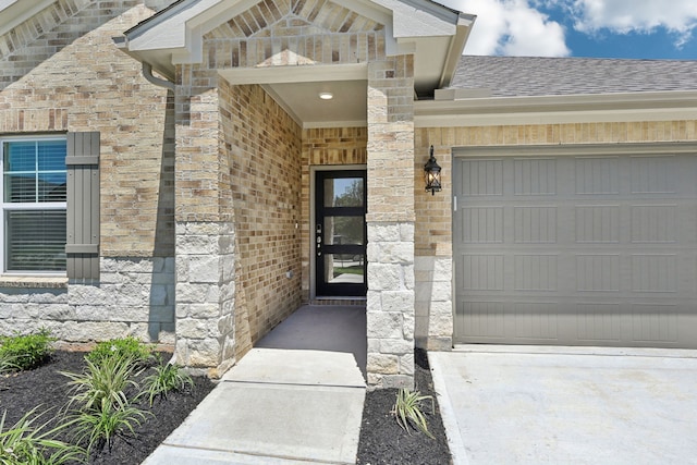 doorway to property featuring a garage