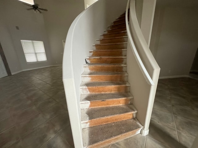 stairway with tile patterned flooring