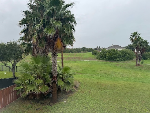 view of home's community with a lawn