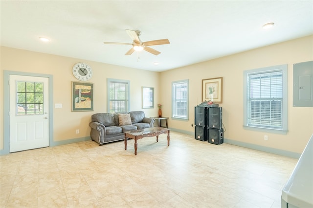 living room featuring ceiling fan and electric panel