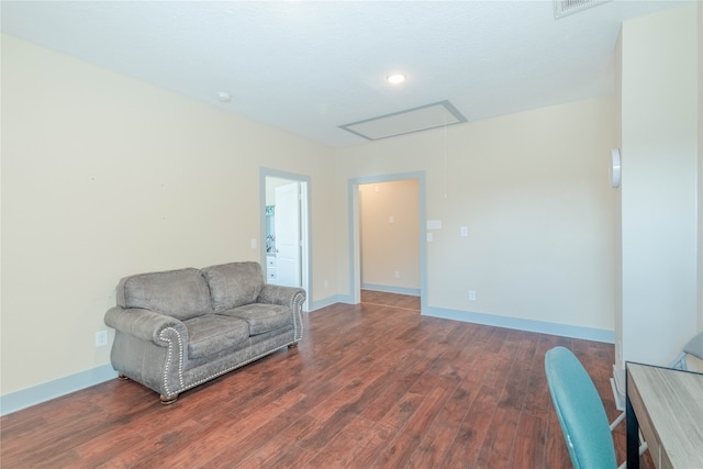 sitting room with hardwood / wood-style flooring