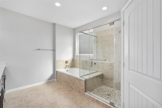 bathroom with vanity, plus walk in shower, and tile patterned floors