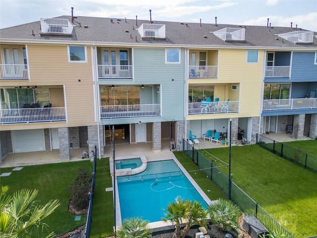 view of swimming pool with a patio area and a lawn